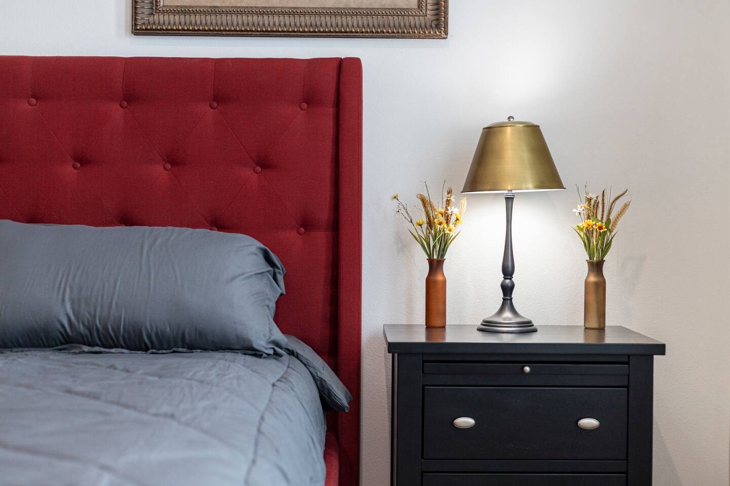 King bedroom with tufted headboard